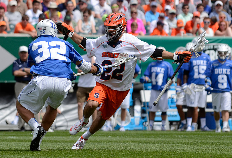 JoJo Marasco dodges inside Blue Devils defender Greg DeLuca. Marasco scored two late goals as SU's comeback fell well short.