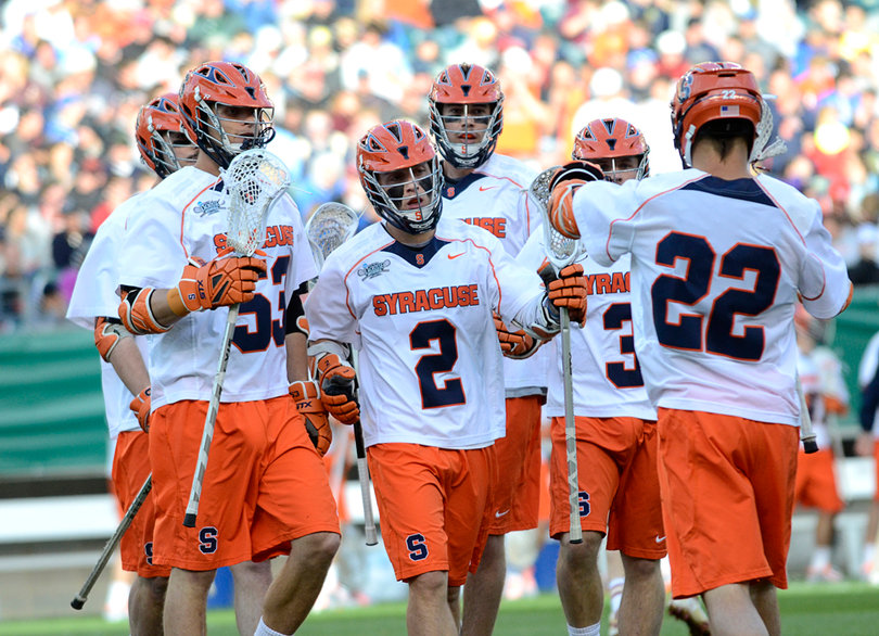 Kevin Rice runs toward captain JoJo Marasco. Marasco keyed the SU attack with five points.