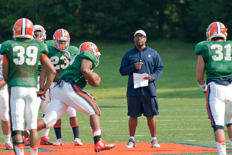 Running backs coach DeAndre Smith instructs his group of ballcarriers.