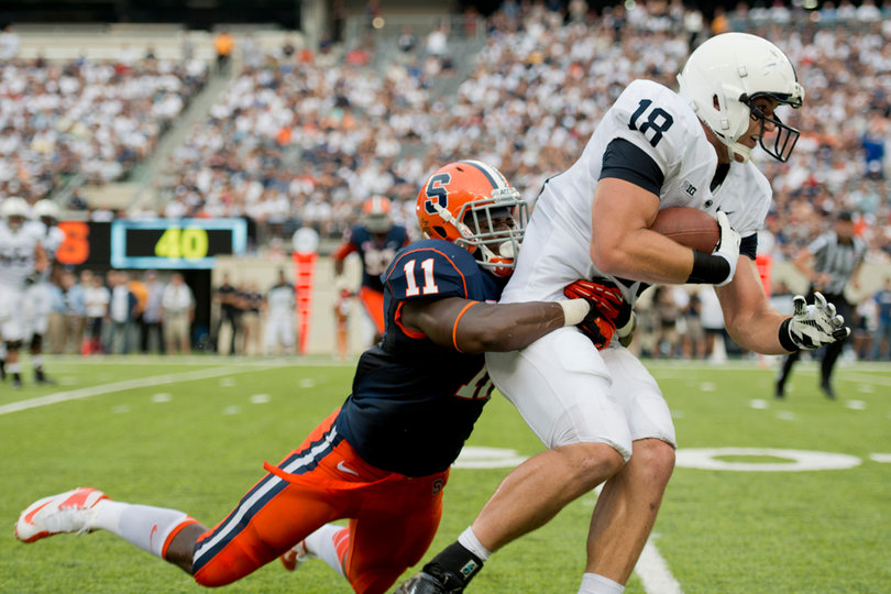 Marquis Spruill tackles 6-foot-7, 257-pound tight end Jesse James. 