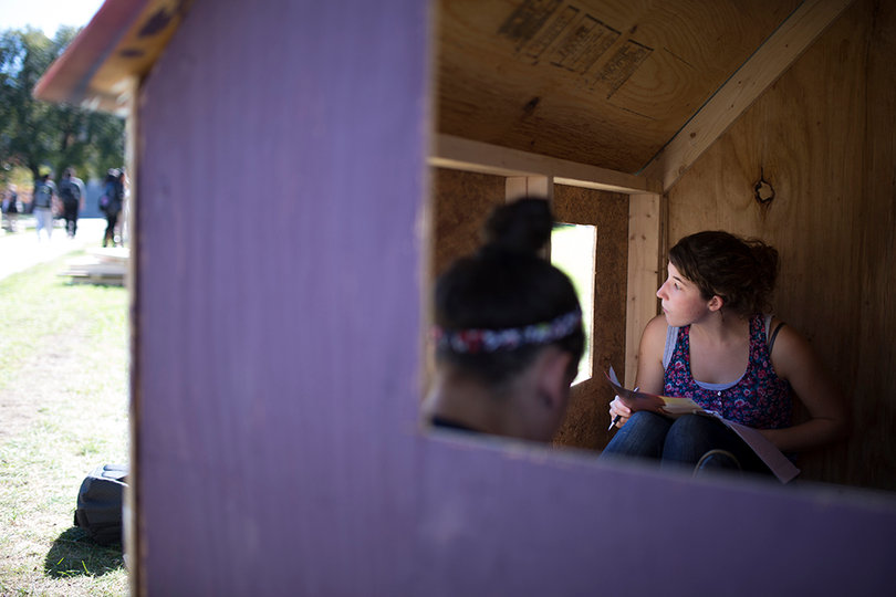 Sept. 25, 2013: Kay Tinder, a  freshman television, radio and film major, sits with friends inside a shack on the Quad as part of Habitat for Humanity's Shack-a-Thon 2013.