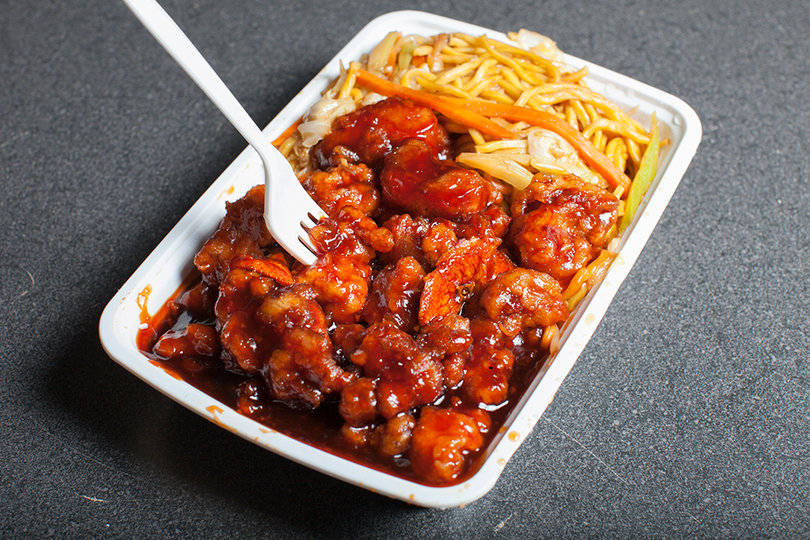 No. 1 Kitchen's rendition of orange chicken is a vibrant red color that comes with a side of vegetable lo mein.