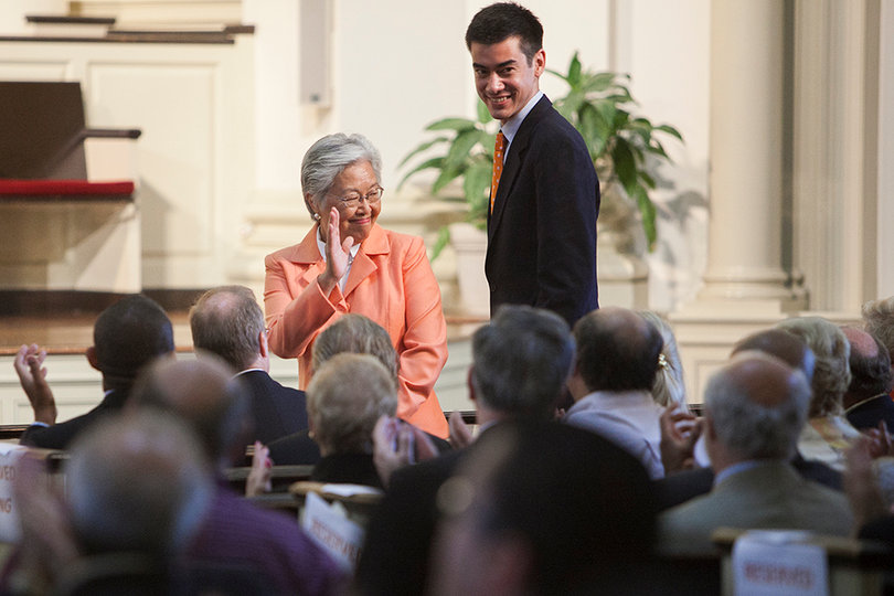 Kent Syverud's wife and son, Ruth Chen and Steve Syverud, respectively, greet the audience at a formal announcement announcing Syverud's position as chancellor.