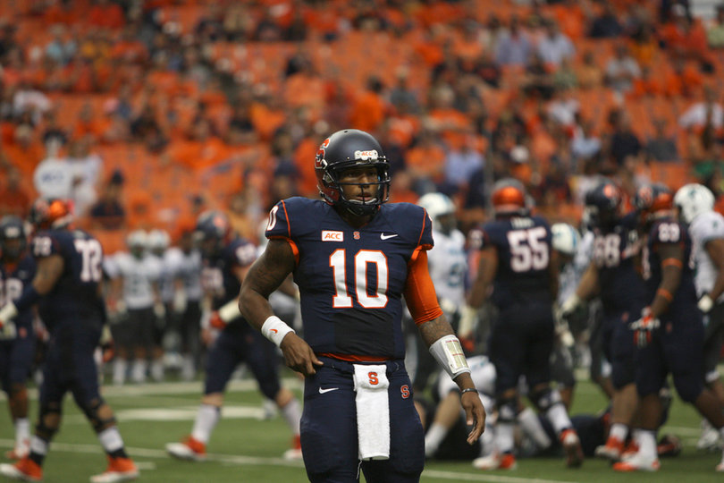 Terrel Hunt stands to the side of the offense. The Syracuse quarterback made his first career start against Tulane.