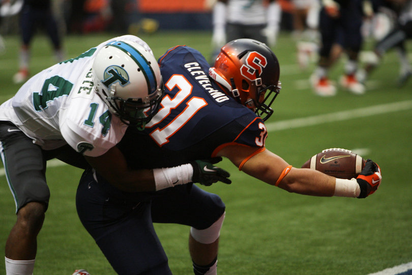 Clay Cleveland stretches toward the end zone as Tulane cornerback Jordan Batiste is unable to bring him down.