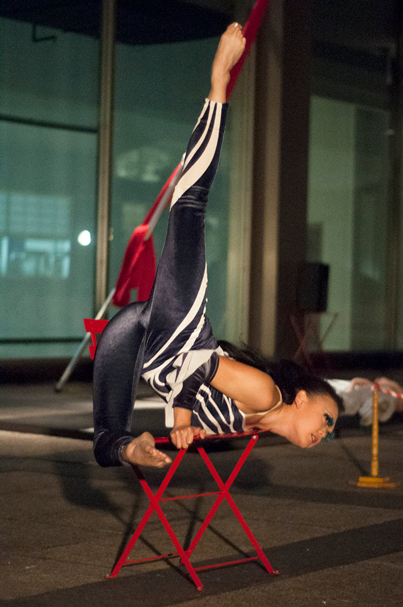 Sora Soliriye, a CirqOvation aerialist and acrobat, poses during a character performance at Cafe Club Surreal on Friday evening.  