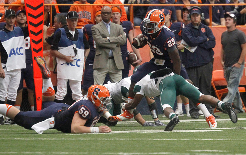 As the Syracuse lead ballooned, running backs George Morris II and Devante McFarlane got playing time. Here, McFarlane tries to elude a Wagner defender. 