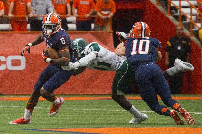 Desir attempts to break a tackle on a return as Josh Kirkland bodies Wagner's Adebwale Godwin. 