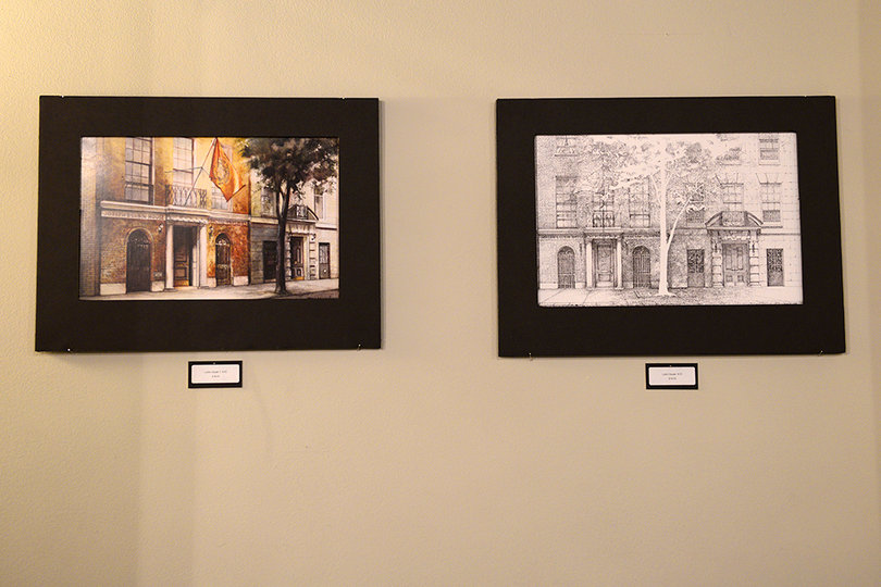 Two of Joseph Murphy's works of art from his “Where the Vale of Onondaga Meets The Eastern Sky” exhibit hang in Café Kubal and depict buildings from all over the SU campus.   
