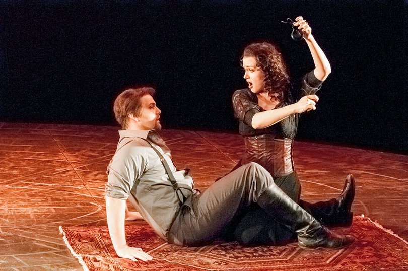 Ola Rafalo, as Carmen, dances for Don Jose (Brent Reilly Turner) on their first night alone together.