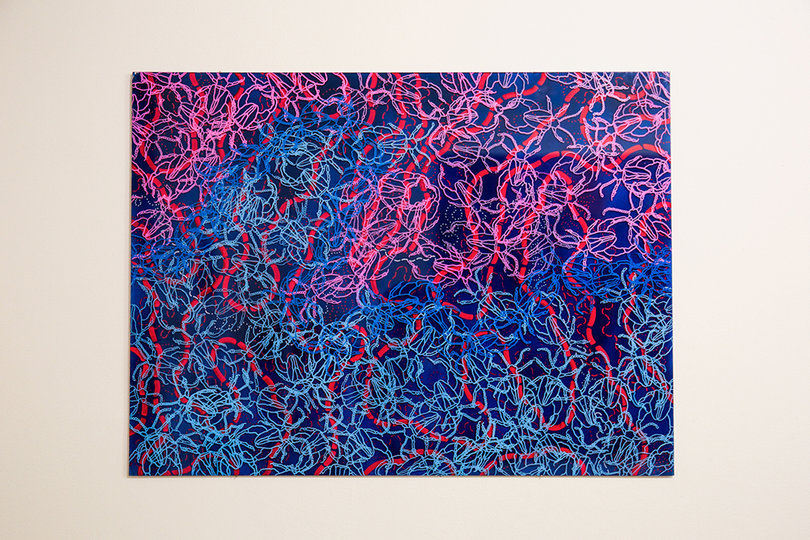 Paul Weiner's abstract painting features brightly colored beetles replicated over and over again. 