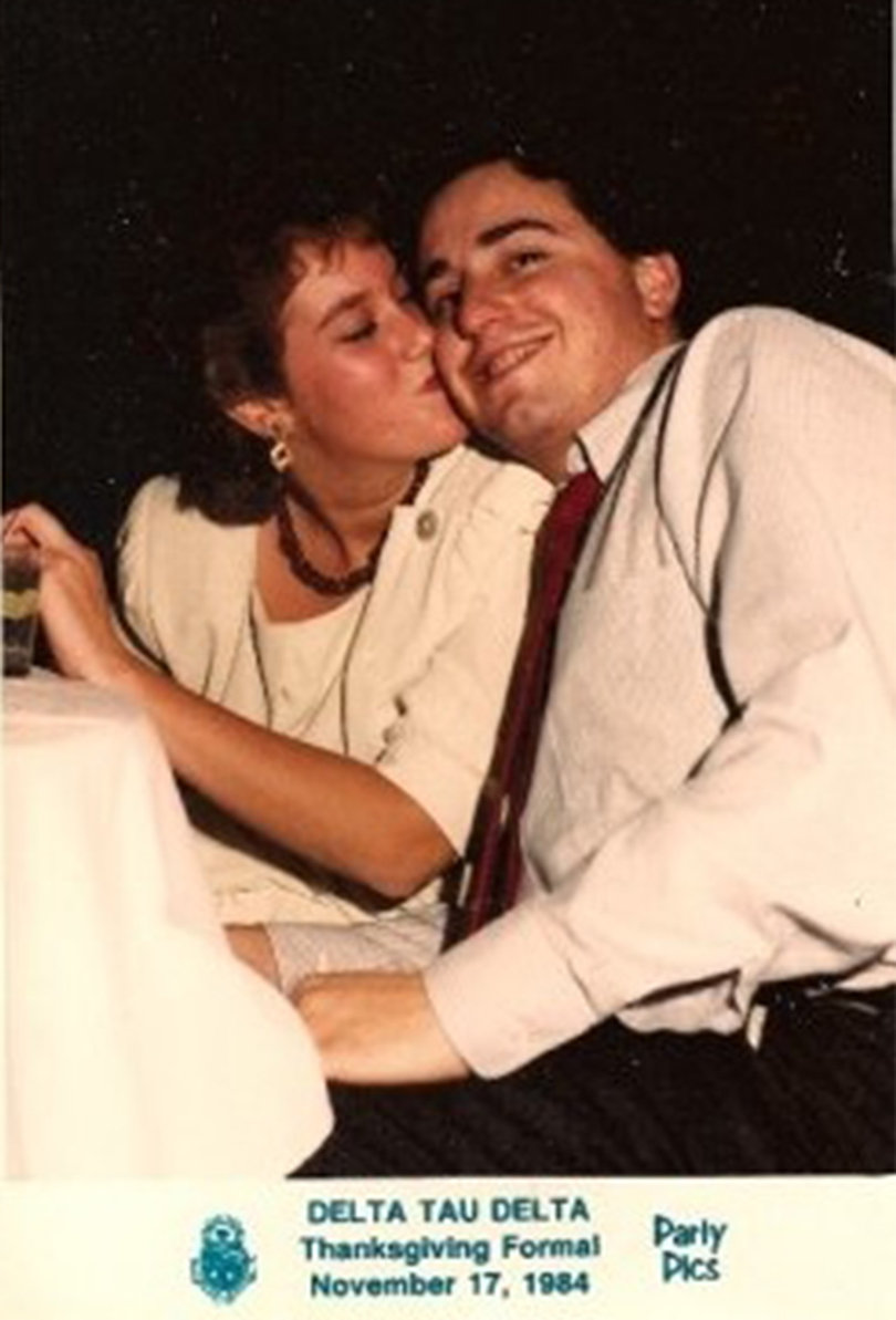 Nancy Appel and Michael Margolis  share a kiss at the Delta Tau Delta Thanksgiving formal in 1984.