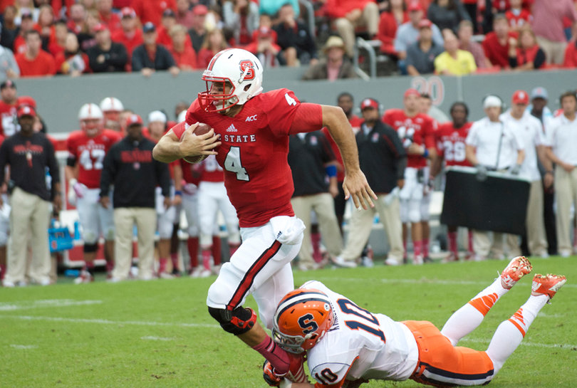 Kirkland brings down NC State quarterback Pete Thomas. 