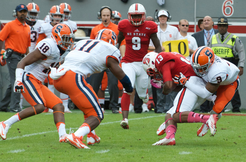 Ri'Shard Anderson tackles Bra'Lon Cherry. 