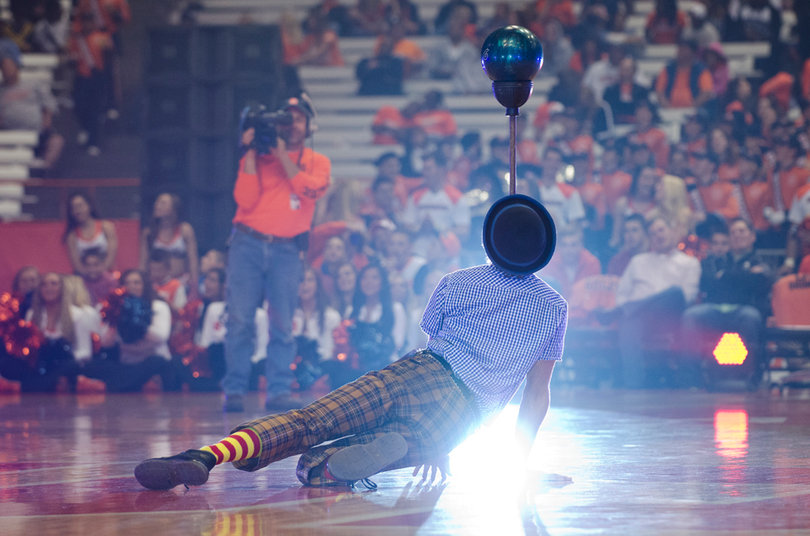 Hilby the Skinny German Juggle Boy performs before the basketball teams scrimmage.