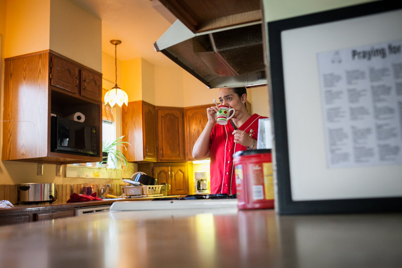 Garcia drinks coffee inside the kitchen of the Exodus House the morning of her speech. 
