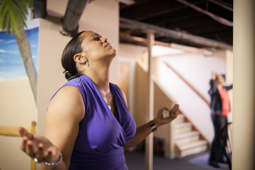 Garcia worships in the basement of the Exodus House just before the start of her graduation ceremony, Saturday Oct. 19.