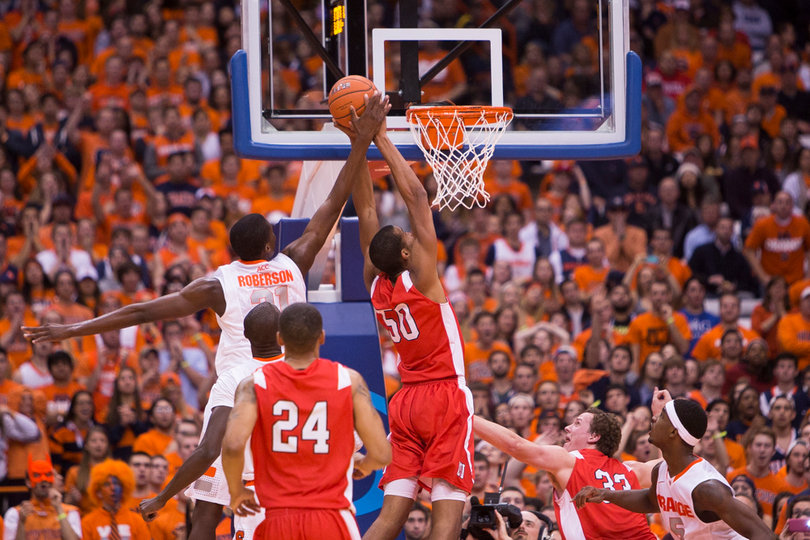 Freshman Tyler Roberson blocks Deion Giddens' dunk attempt as time expires in the first half. 