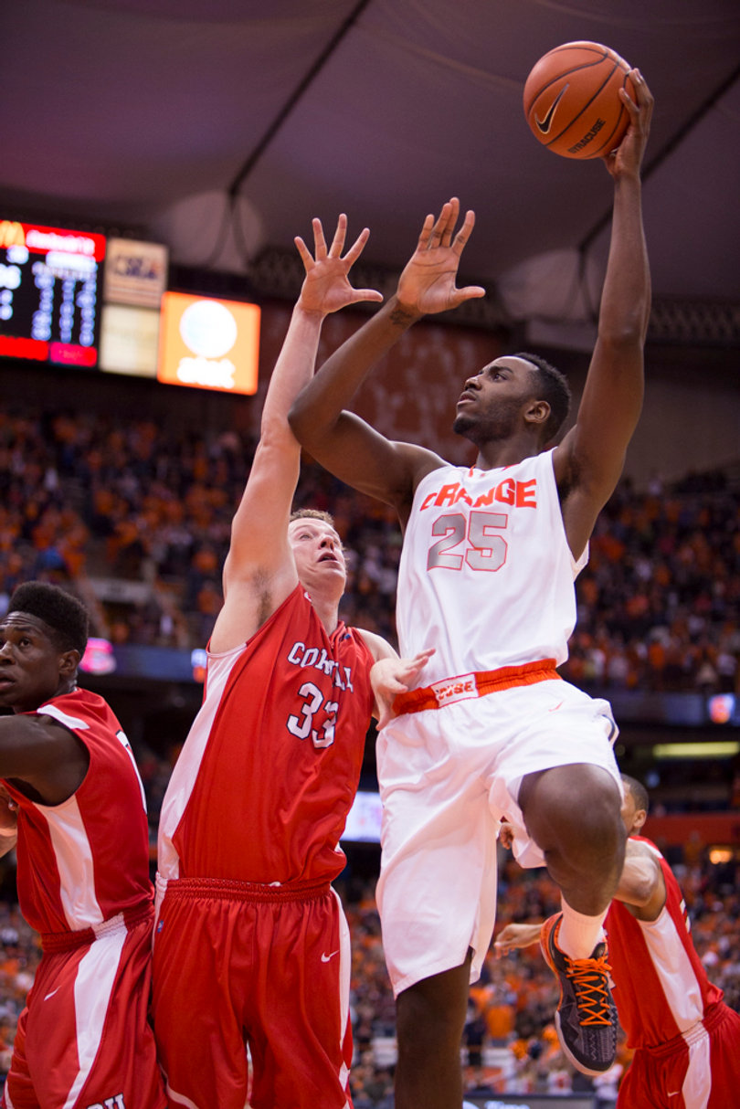Rakeem Christmas rises up for a hook shot over Cornell's Dwight Tarwater. Christmas finished with 12 points. 