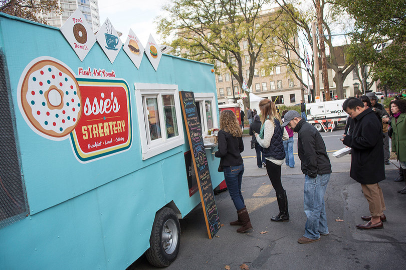 People line up at Ossie’s Streatery at the “Zip Fest” Street Fair and Food Truck Rodeo. The event marked the start of Phase Two of the Connective Corridor construction plan.
