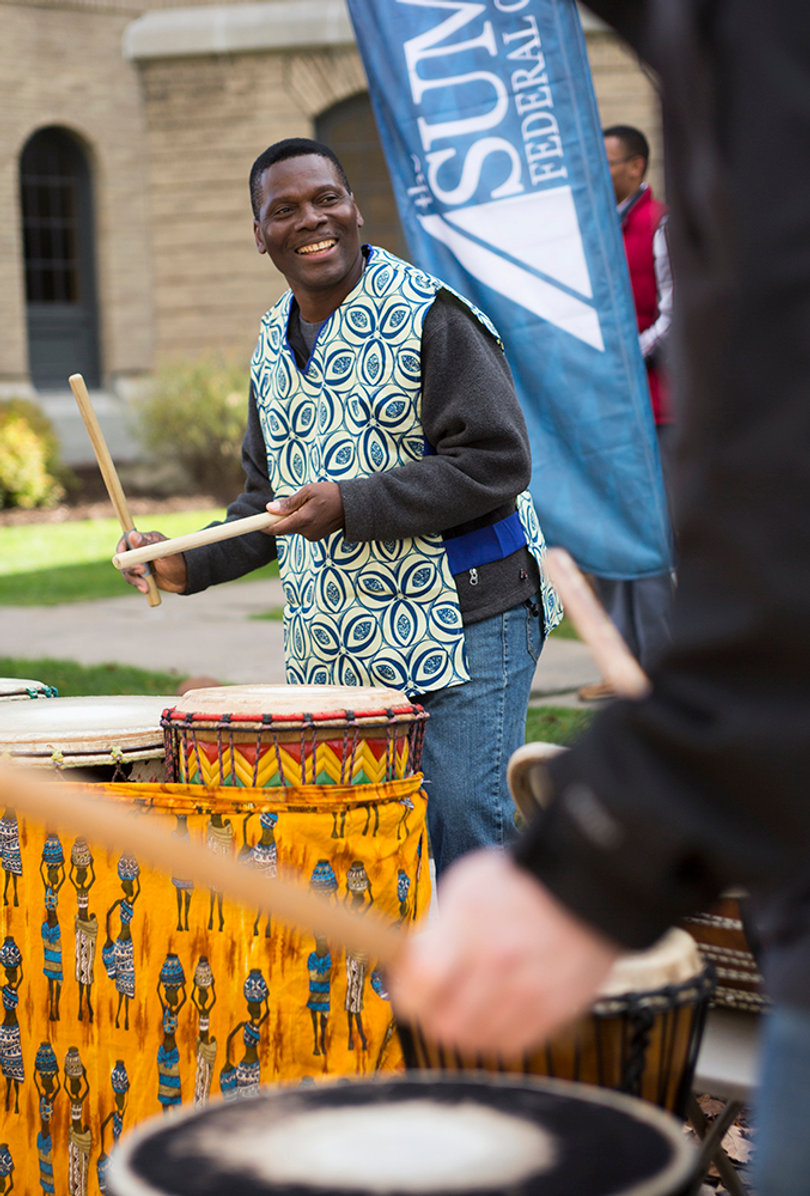 Biboti Ouikahilo, the founder of Wacheva, leads a drum circle.