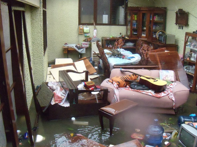 Jayson Kristopher, boyfriend to a family member of SU student Stephanie Bronfien, faced a flooded home. The house was robbed 30 minutes after the photo was taken, with only cabinets left behind. 