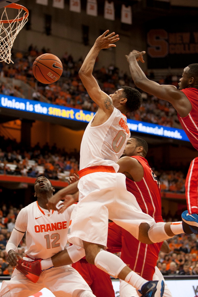 Forward Michael Gbinije is one of the first players off of the Orange's bench and Syracuse's backup point guard.