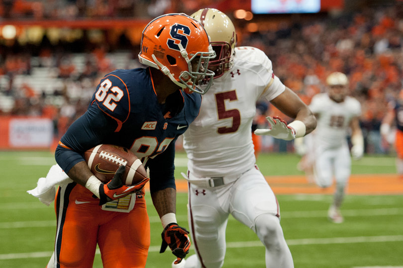 Alvin Cornelius eludes BC defensive back Al Louis-Jean. The redshirt freshman caught seven passes for 81 yards. 