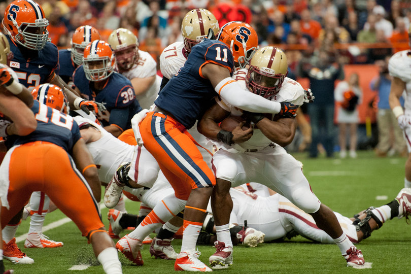 Marquis Spruill wraps up Heisman candidate Andre Williams before he reaches the line of scrimmage.  