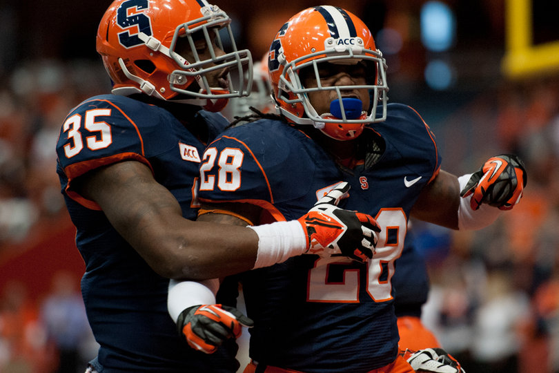 Safety Jeremi Wilkes celebrates with linebacker Dyshawn Davis after making a big play. 