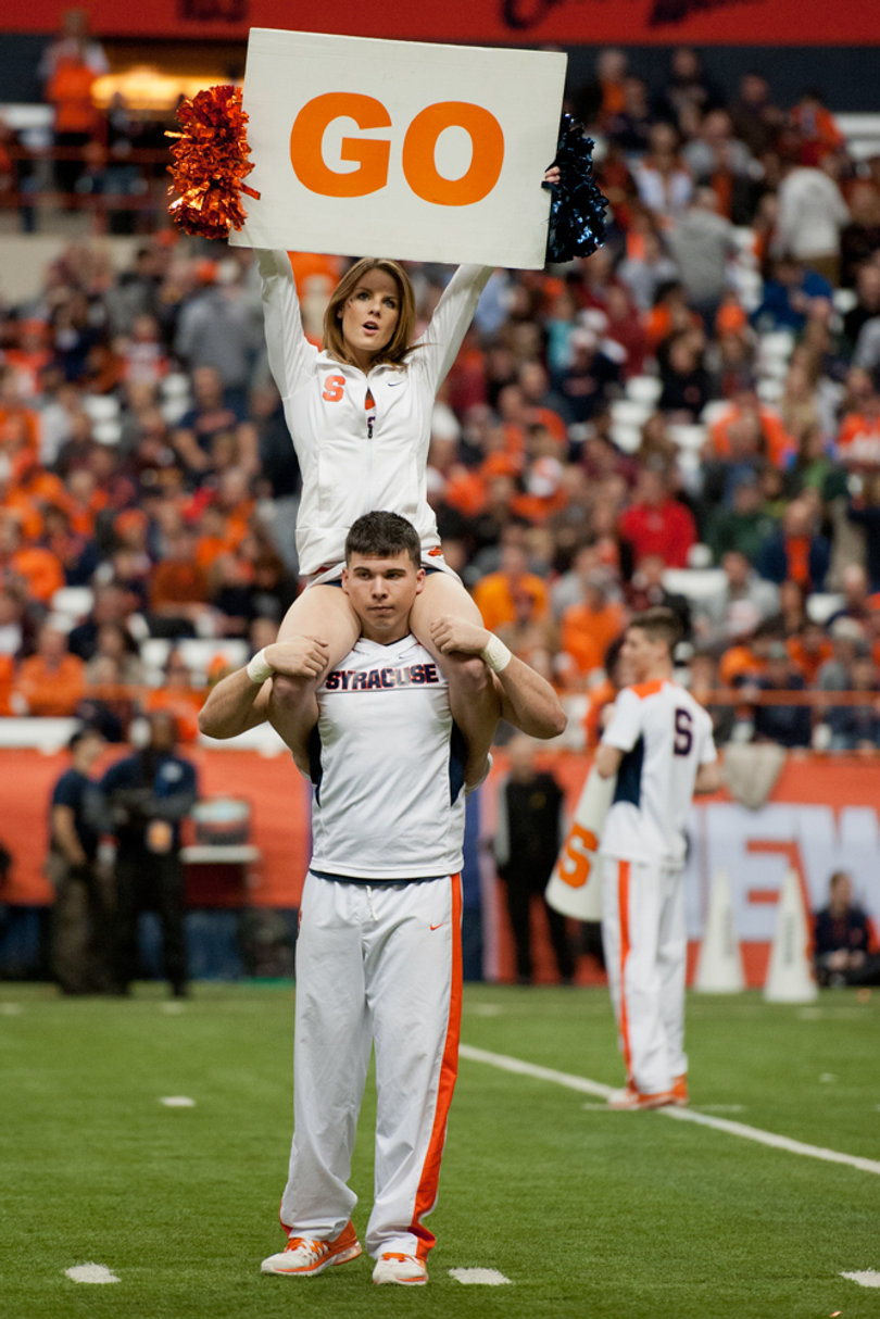 An SU cheerleader leads the crowd in a familiar Carrier Dome chant. 