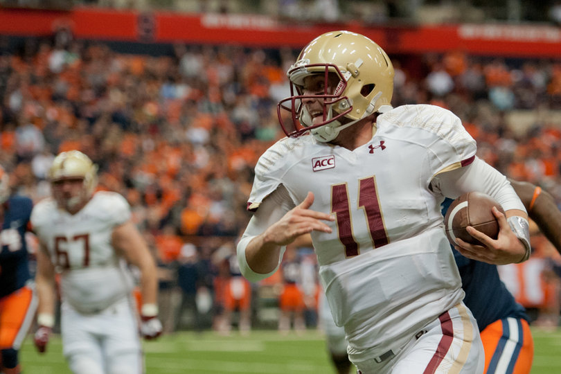 BC quarterback Chase Rettig carries the ball upfield for some of his 85 rushing yards. Rettig ran for a score, and threw for two more. 