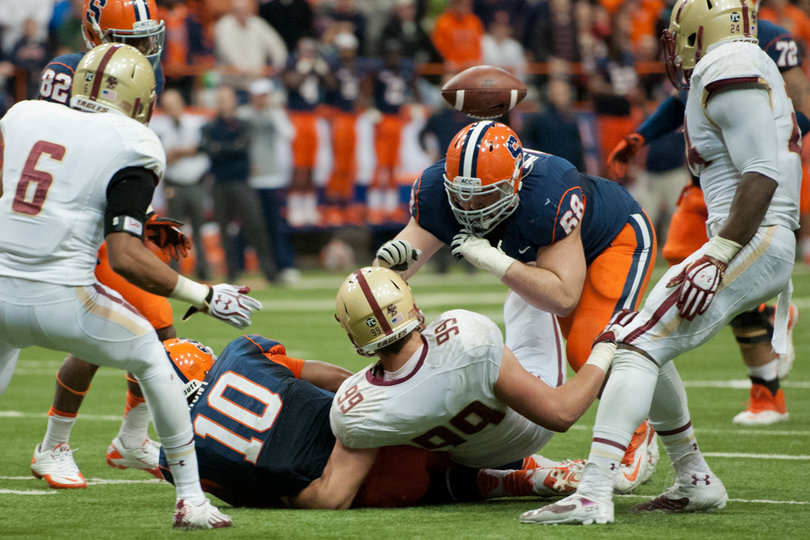 Guard Nick Robinson protects his quarterback who was swallowed up by the BC defense. 
