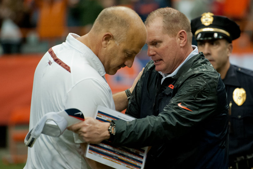 A wet Shafer shares a moment with Addazio after the game clock expired. 