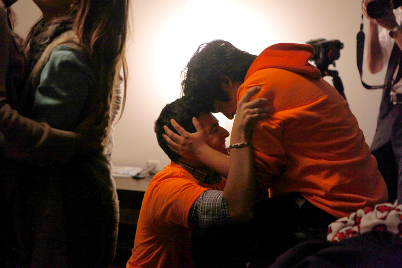 Boris Gresely (Left) hugs Iggy Nava (Right) after hearing about Gresely's win in the 2013 Student Association presidential election. 