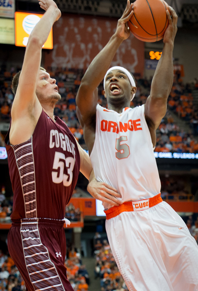 Fair goes up for a lay-up against Jacobs. 