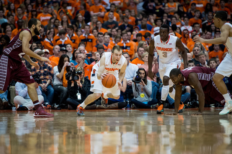 Cooney scans the floor while jumpstarting the Syracuse fast break. 