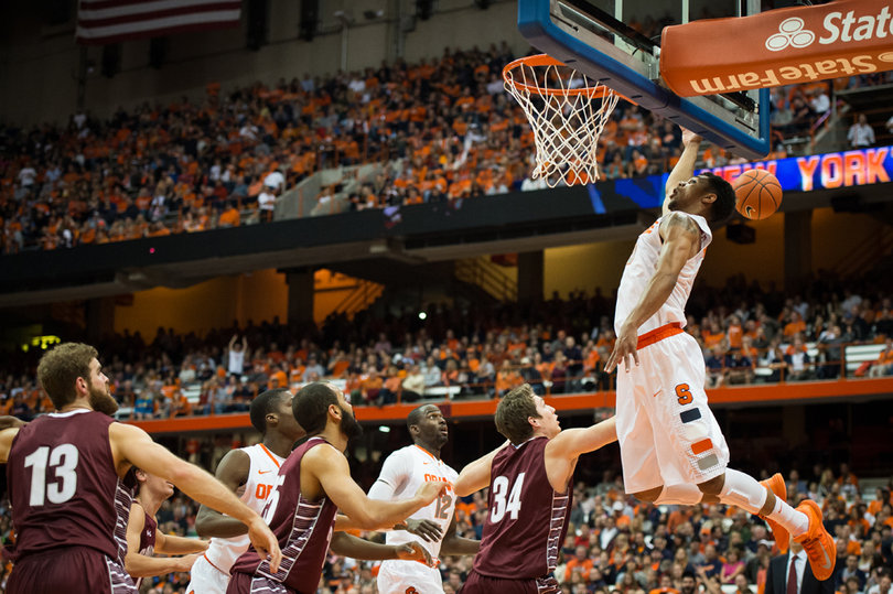 Michael Gbinije loses the ball while going up for a baseline lay-up. 