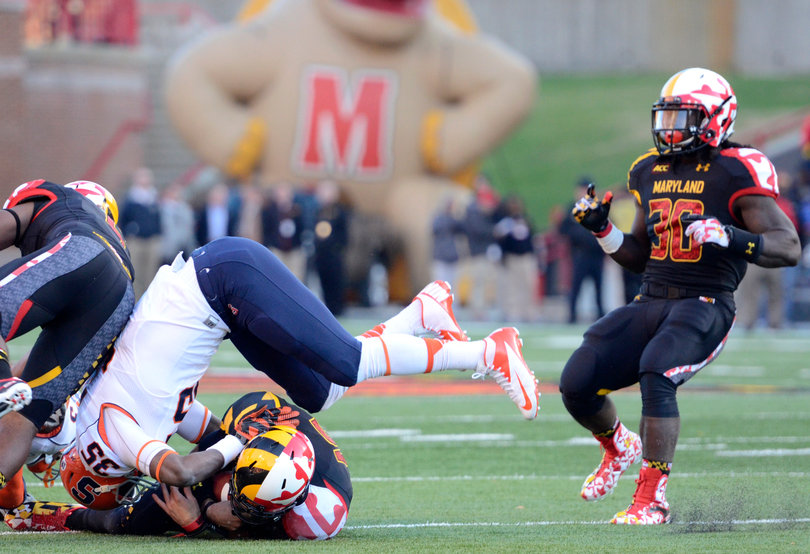 Dyshawn Davis pounces onto a Maryland player. 
