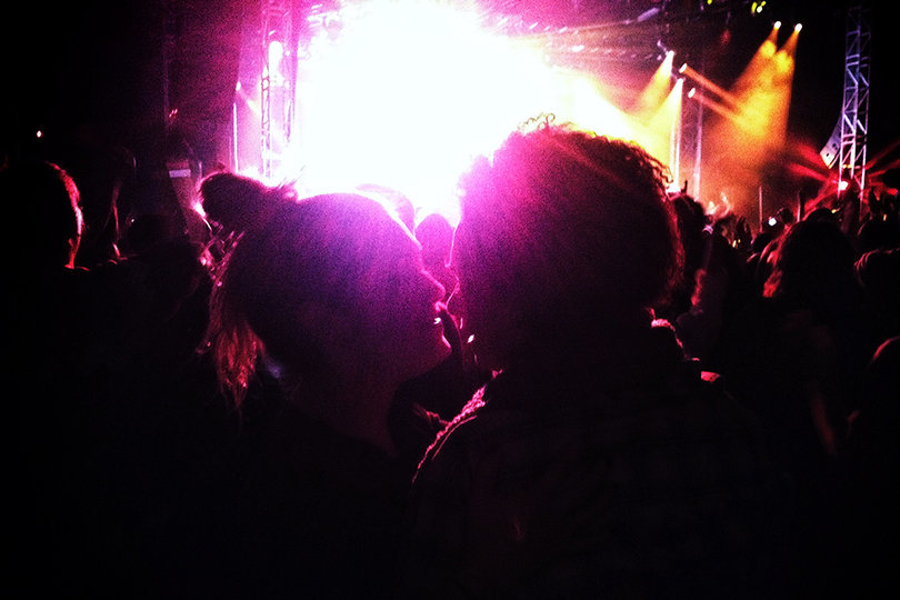 Jillian Clark (L) and Ryn Adkins (R) share a moment and embrace each other during Macklemore's performance of "Same Love."