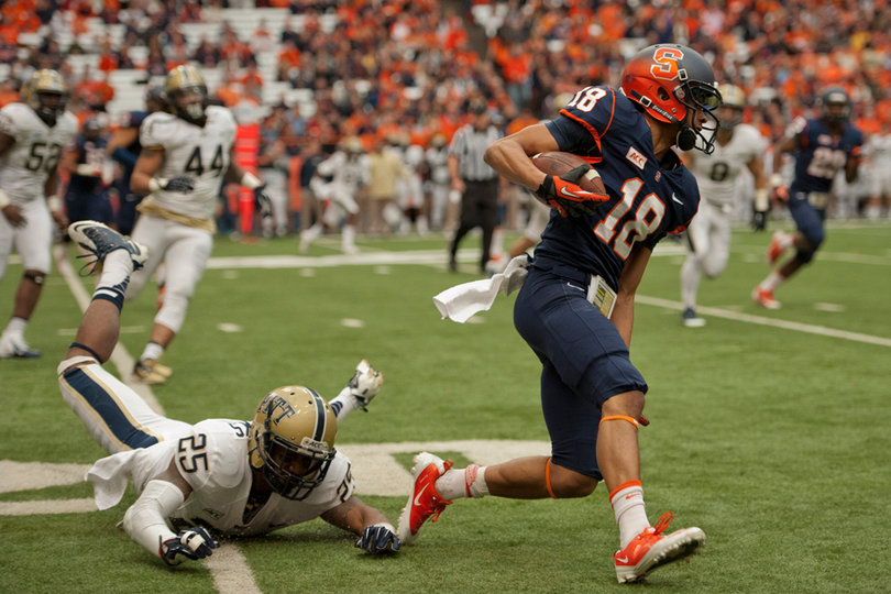 SU wide receiver Christopher Clark slips past the Pitt defense for a gain.