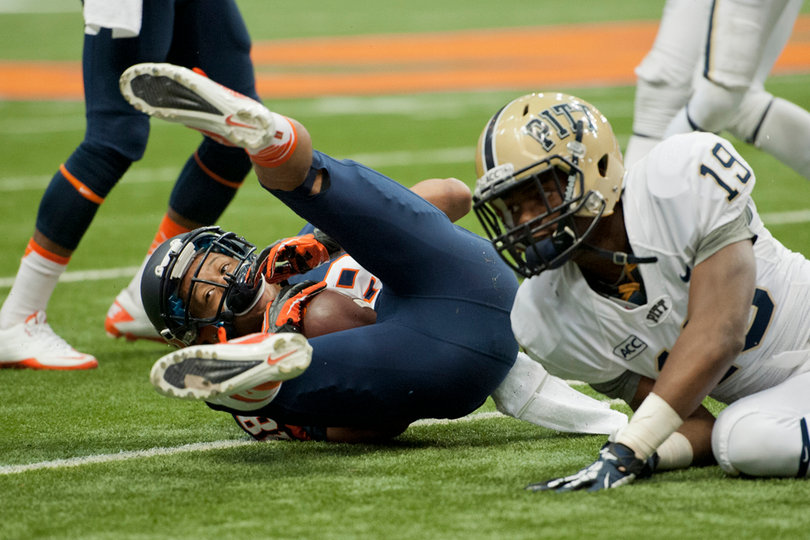 Clark falls to the ground after making a catch.