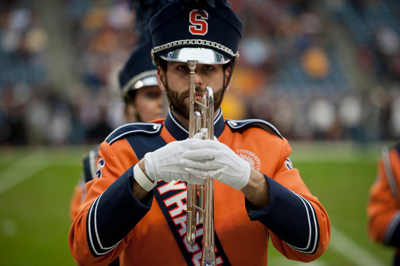 A member of the SU marching band waits to begin a routine.