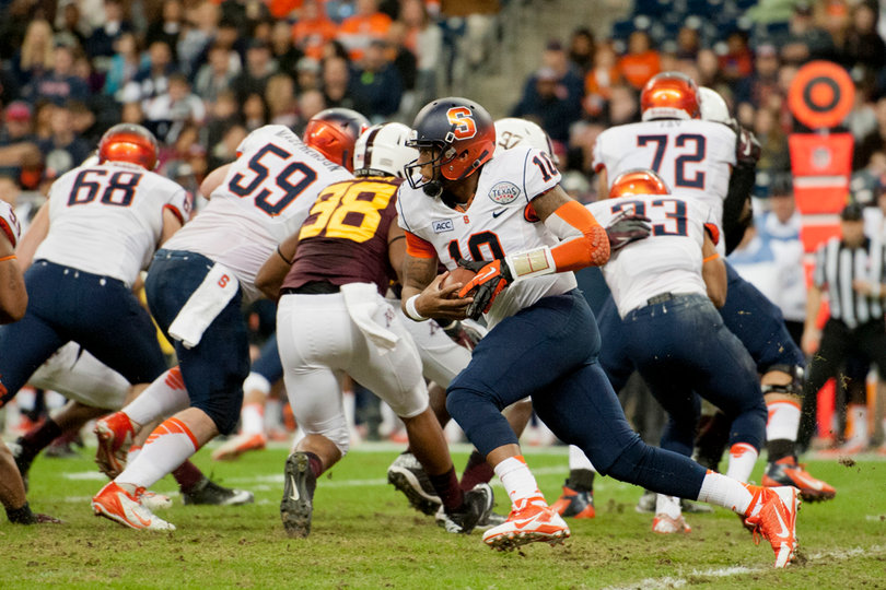 Terrel Hunt extends the play after a fake handoff.