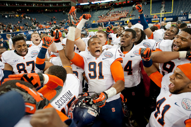 Syracuse celebrates following its victory over Minnesota in the Texas Bowl.