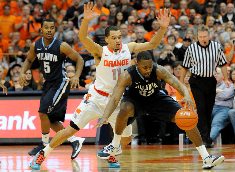 Tyler Ennis pressures James Bell.