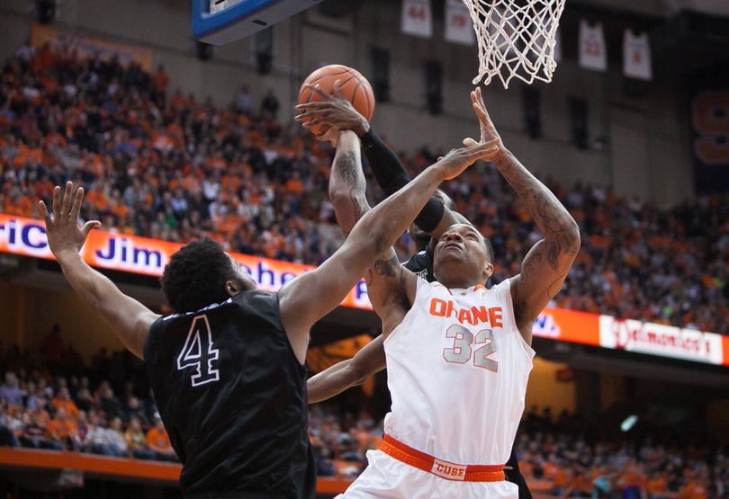 DaJuan Coleman goes up for a shot but is blocked. 