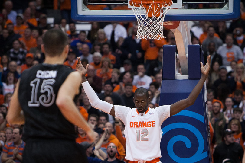 Baye Moussa Keita calls for the crowd's applause during SU's victory. The Orange led by just three points at halftime before holding High Point to 18 second-half points.