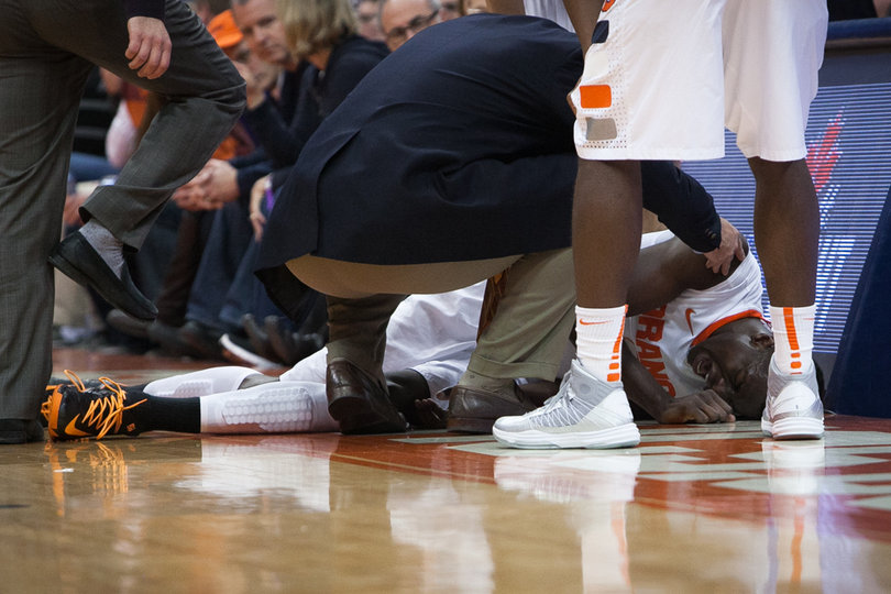 Jerami Grant tried to get down to the other end of the court, but couldn't make it. He lies on the side of the court in pain after injuring his left ankle.