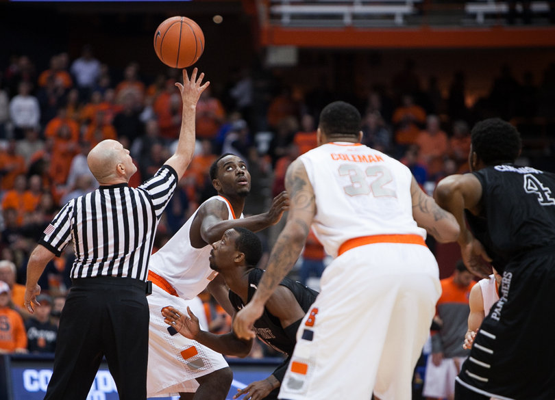 Rakeem Christmas and John Brown prepare for the tip-off. 